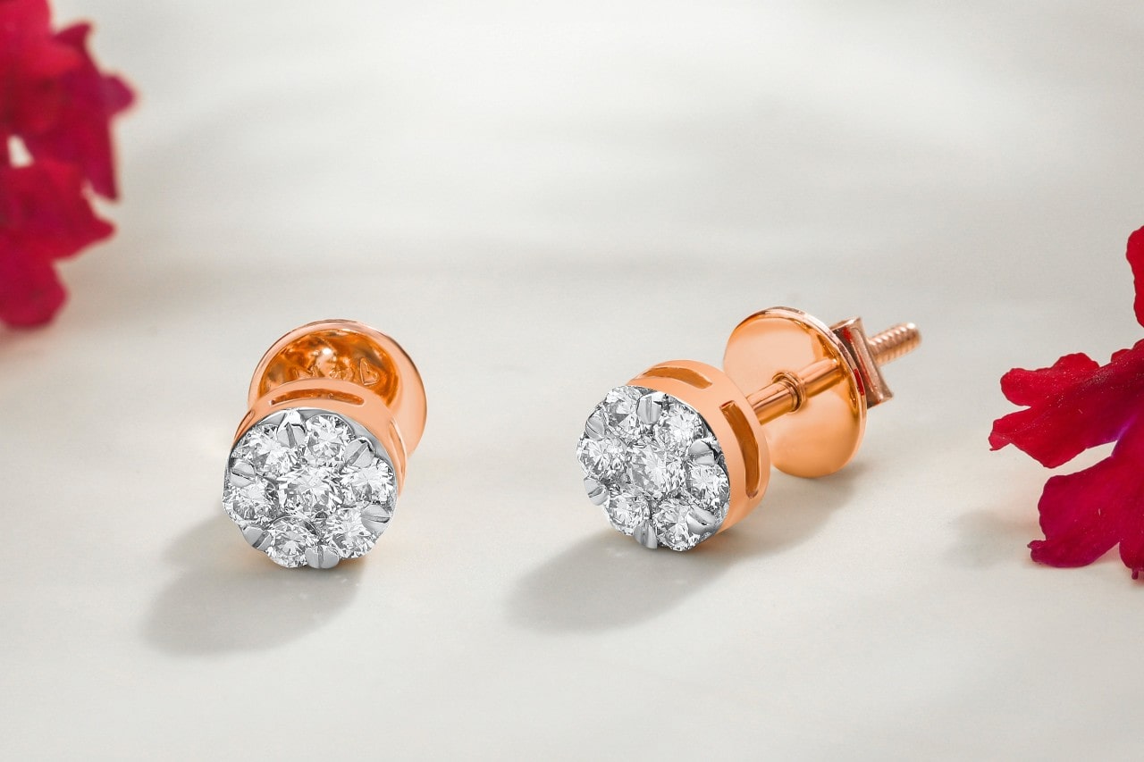 A close-up of a vibrant pair of rose gold diamond earrings A close-up of a vibrant pair of rose gold diamond earrings
