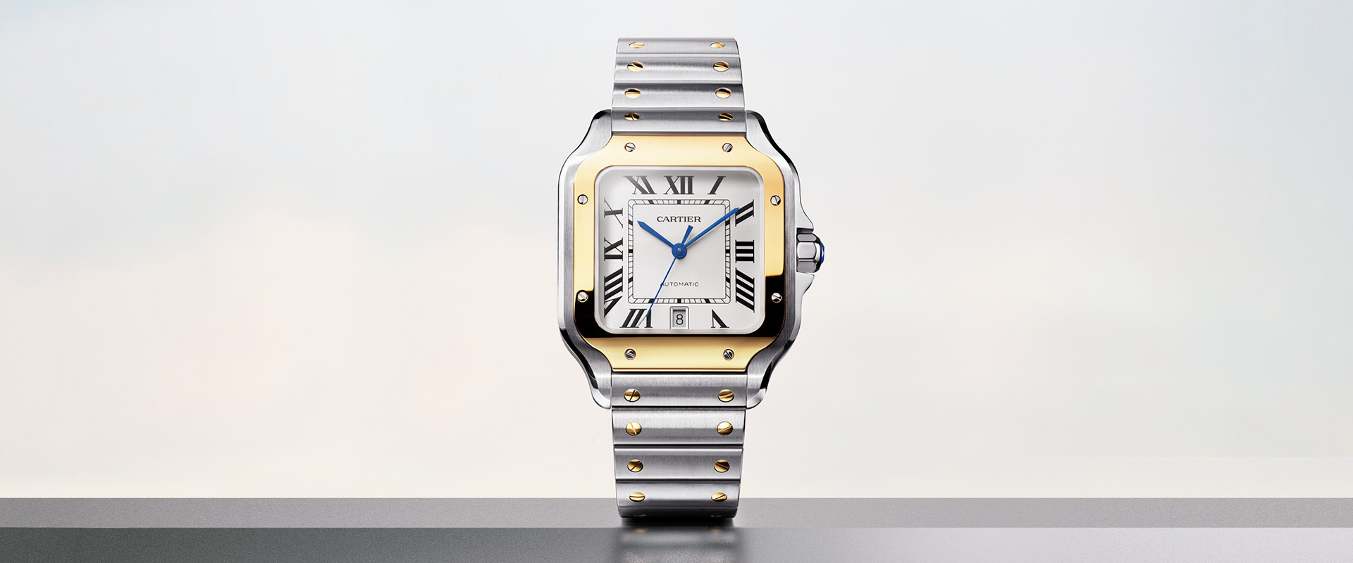 Santos Cartier watch on a gray background