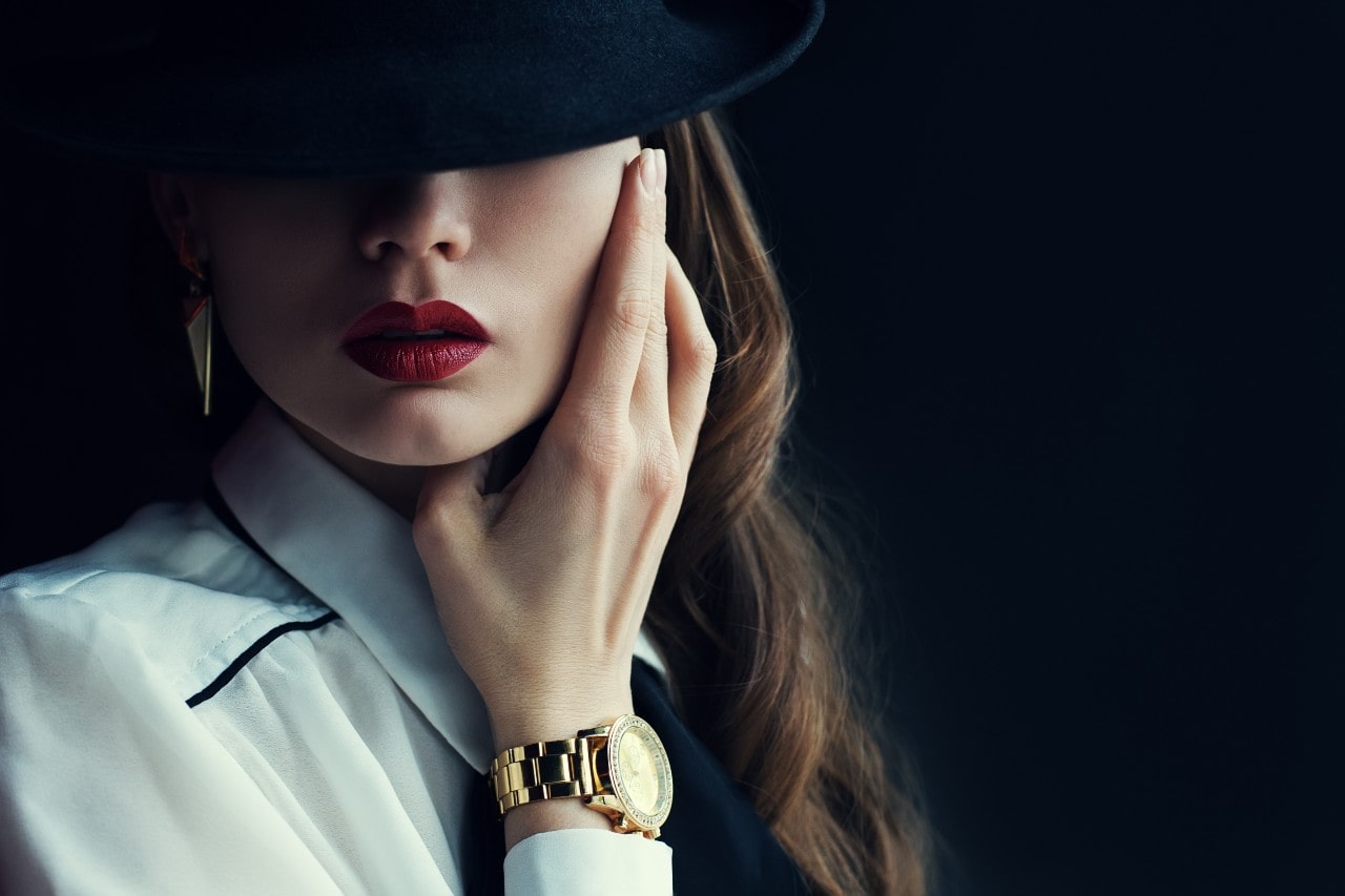 woman with timepiece on wrist